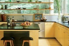 10 a light-stained modern kitchen with suspended shelves instead of upper cabinets and a large contrasting kitchen island