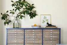 15 a renovated navy file cabinet with some lovely decor is a cool way to upcycle a piece and make your space cooler