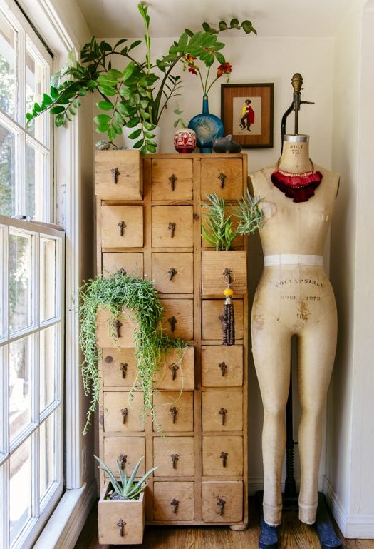 A vintage stained card cabinet as a storage unit and a plant stand is a lovely and cool idea for a vintage infused space