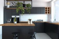 26 a contemporary black kitchen with butcherblock countertops, a suspended shelf over the kitchen island and a white tile backsplash