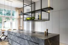 37 a refined minimalist kitchen with sleek white cabinetry, a grey marble kitchen island, suspended shelves and built-in lights