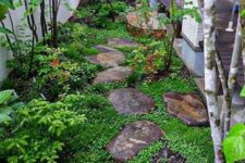 45 a small Japanese-inspired garden with rocks as pavements, greenery, shrubs and a couple of trees is very peaceful