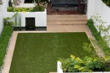 57 a minimalist townhouse garden with white flower beds with greenery, a tiny pond, a manicured lawn, a sectional sofa and a hot tub