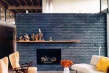 17 a beautiful navy brick fireplace with a stained mantel and cool decor on it is a decor piece that takes over the whole space