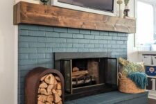 18 a blue brick fireplace is lovely finished off with a wooden mantel and accented with a basket with towels and a firewood storage
