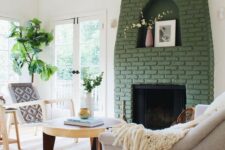 30 a green brick fireplace with a niche for art looks out of the box and adds color to this neutral living room