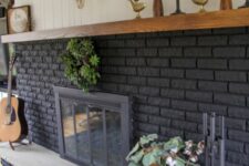 34 a large graphite grey fireplace with potted plants and arrangements, candles and lovely boho decor is a cool idea for a boho space