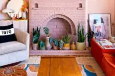 41 a pink brick fireplace with potted plants instead of fire is a cool and fresh decor idea for a boho space