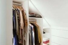 a minimalist white built-in closet with built-in lights and shelves is a cool solution for a small home, it’s smart and cool