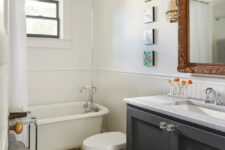 a lovely bathroom with shiplap walls