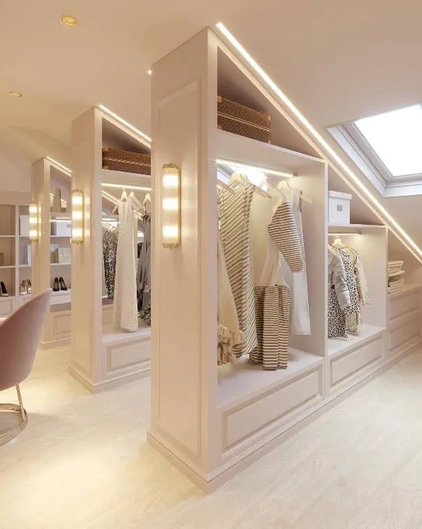 A stylish neutral attic turned into a walk in closet with open shelving and lights is a gorgeous solution to use your attic space