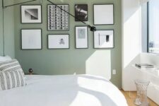 a lovely bedroom with a gallery wall