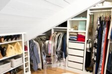 an attic closet with open storage compartments, drawers and built-ins is a very cool and smart idea for a home with an attic space