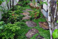 04 a small Japanese-inspired side yard with rocks as pavements, greenery, shrubs and a couple of trees is very peaceful
