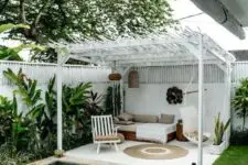 05 a cozy boho chic cabana done in white and neutrals and a small swimming pool clad with neutral tiles