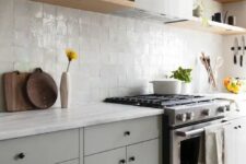 06 a chic dove grey kitchen with a white zellige tile backsplash, light-stained shelves and white stone countertops is amazing