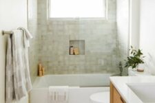 11 a modern bathroom with neutral walls and green terrazzo tiles, a stained vanity, a neutral tiled floor and white appliances