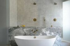 17 a neutral bathroom with a shower space clad with grey zellige tiles, with a bathtub space done with grey marble is wow
