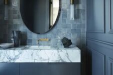 21 a refined moody bathroom with graphite grey walls and a vanity, a grey zellige tile backsplash and a marble countertop is wow