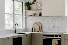 27 a refined modern kitchen with sleek grey cabinets, a Zellige tile backsplash, a hood and open shelves, black fixtures