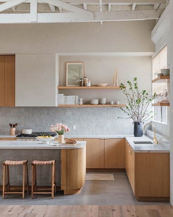 an airy contemporary kitchen with stained cabinets and a kitchen island, open shelves, a grey zellige tile backsplash