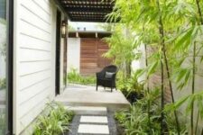 40 a low-maintenance side yard with pebbles, tiles, greenery and bamboo is a lovely idea for a modern home