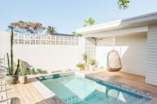 53 a welcoming natural backyard with a plunge pool clad with printed tiles, rattan furniture and planted cacti and succulents