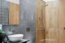 a bathroom with mixed concrete and wooden tiles