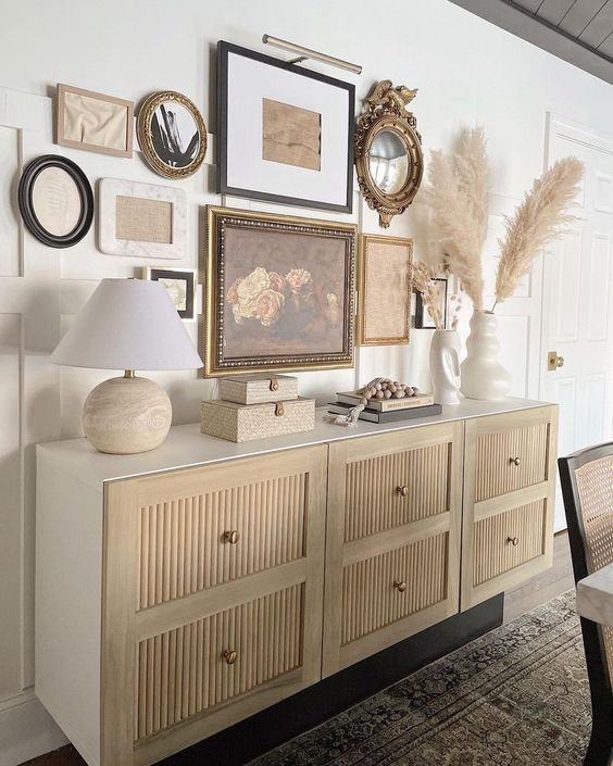 a beautiful and elegant fluted credenza with a gallery wall over it and some cool decor on it will be a perfect addition to your space
