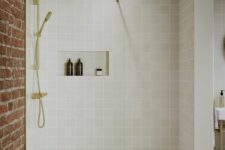 05 a chic modern shower space clad with grey square tiles, with a niche for storage, gold fixtures is a lovely idea for a modern bathroom