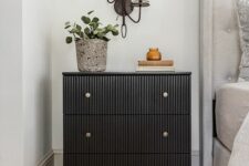 12 a cool IKEA Tarva dresser renovation into a trendy fluted piece with brass knobs, it becomes a functional nightstand
