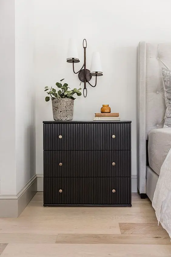 a cool IKEA Tarva dresser renovation into a trendy fluted piece with brass knobs, it becomes a functional nightstand