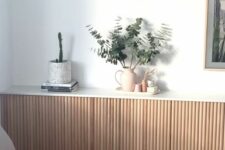 15 a fluted credenza with some greenery, books and decor is a lovely idea for a modern or Scandinavian space