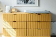 19 a fluted yellow IKEA Tarva dresser used as a changing table, for placing artwork, candles and lights is a cool idea