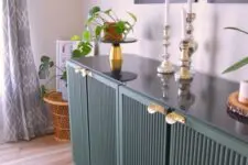 20 a forest green fluted IVAR sideboard with gold handles, decor, potted plants and candles is a lovely idea for a modern space