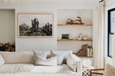 41 a beautiful neutral living room with built-in shelves with decor, a white cotton sofa, a wooden coffee table and rattan chairs
