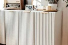 42 neutral fluted storage units on tall gold legs and some vintage decor will be a perfect fit for a modern or Scandinavian space