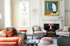 51 a colorful eclectic living room with a fireplace, lilac chairs, an orange velvet sofa, Moroccan furniture, a rug and poufs is bold