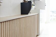59 a neutral fluted console table is a great idea for a small space, it looks chic, elegant and sleek and provides you with storage space