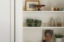 60 an arched niche that houses some shelves with porcelain, books, decor and potted plants is a lovely and cool solution