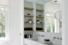 63 a contemporary bathroom with a large niche, with a double sink and niche shelves inside is a cool idea