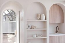 63 an arched niche with shelves and lovely and stylish decor will ad decorative value to your kitchen or some other space