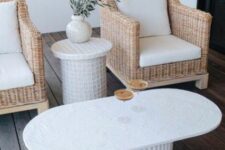 68 a small and cool terrace with wicker chairs, a side table and a fluted coffee table looks ethereal and trendy