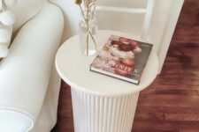 73 a white side table with a fluted base is a cool solution for a modern or Scandinavian living room, you can DIY one