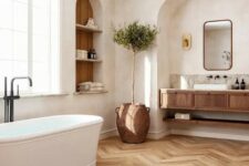 80 a welcoming bathroom with an arched niche and a built-in vanity inside it, an arched niche with storage shelves and an oval tub