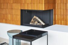 a stylish gold minimalist fireplace