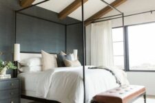 a cozy bedroom with a grasscloth wallpaper
