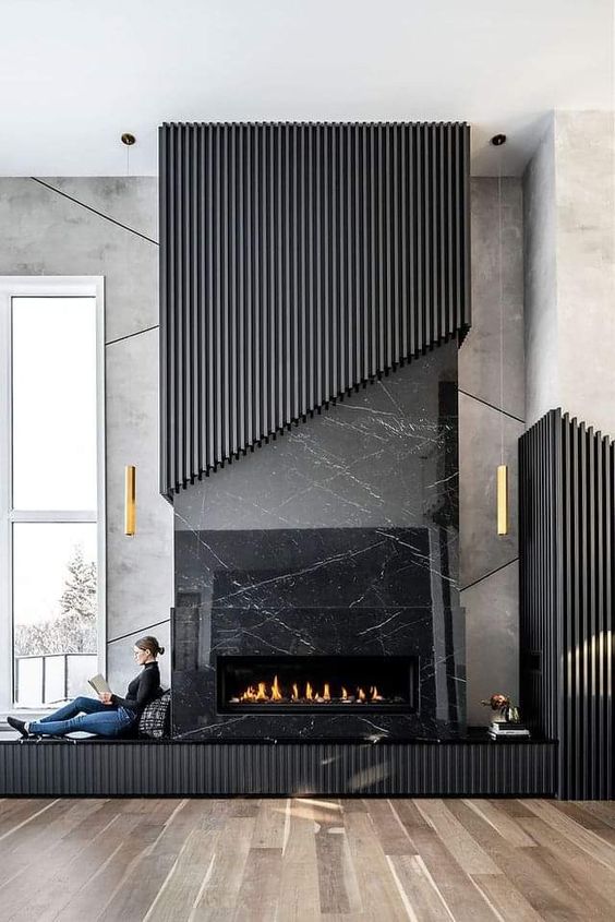 a fireplace with a fluted surround and a matching fluted storage panel is a cool and refined idea for a living room