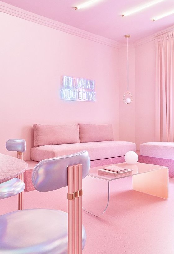 a minimalist pink living room with pink sofas and a coffee table, a pink table and holographic chairs, neon lights is a very eye-catchy space