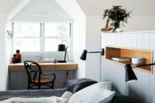 a stylish bedroom combined with a small home office